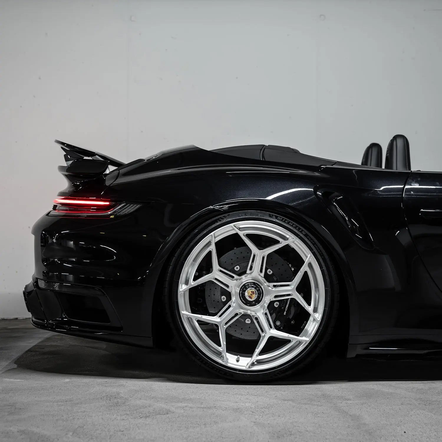 Detail rear Porsche 992 Turbo S with Radi8 R804.C Silver forged wheels – aggressive stance